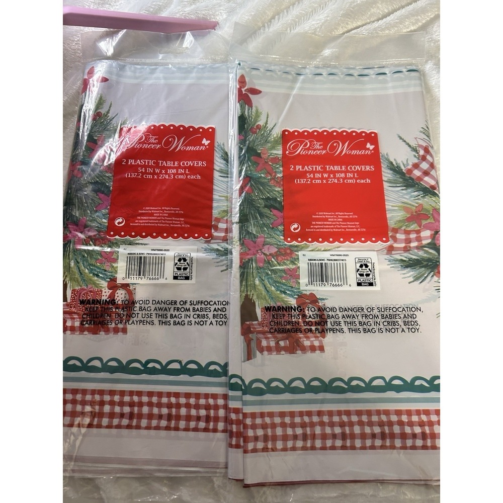 The Pioneer Woman Ribbons & Bows Christmas Plastic Table Covers 54x108 4 Count - Picture 3 of 3